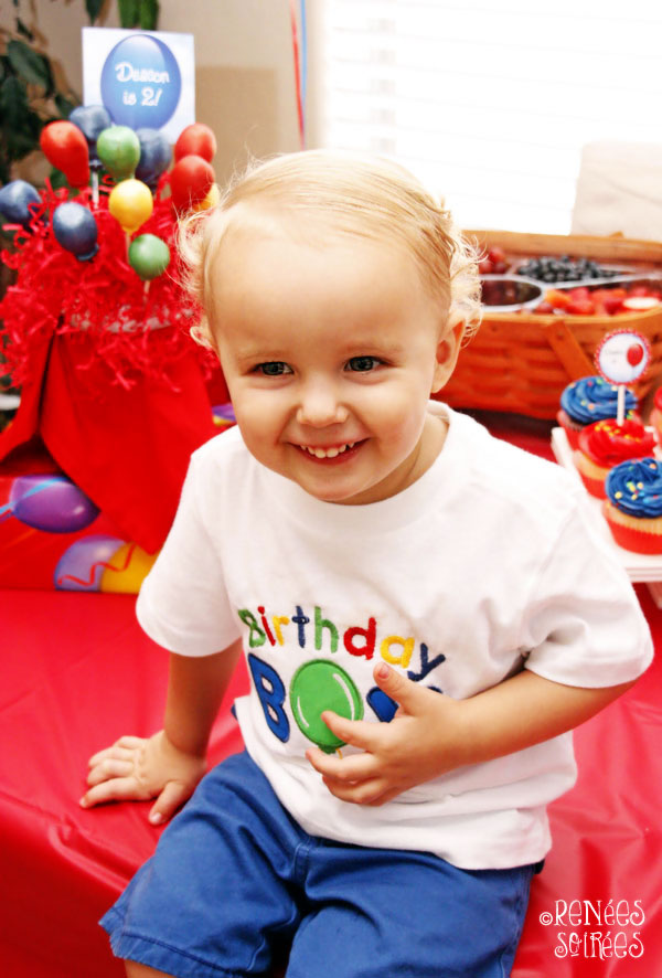 Birthday child in applique shirt with a balloon