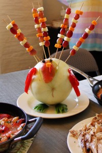 Honeydew melon with skewered fruit that looks like a turkey