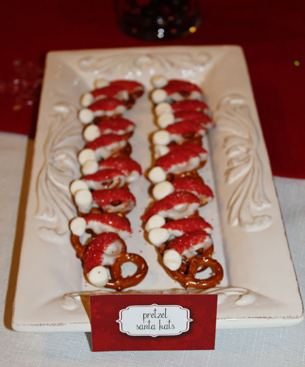 White-chocolate dipped pretzels that look like santa hats